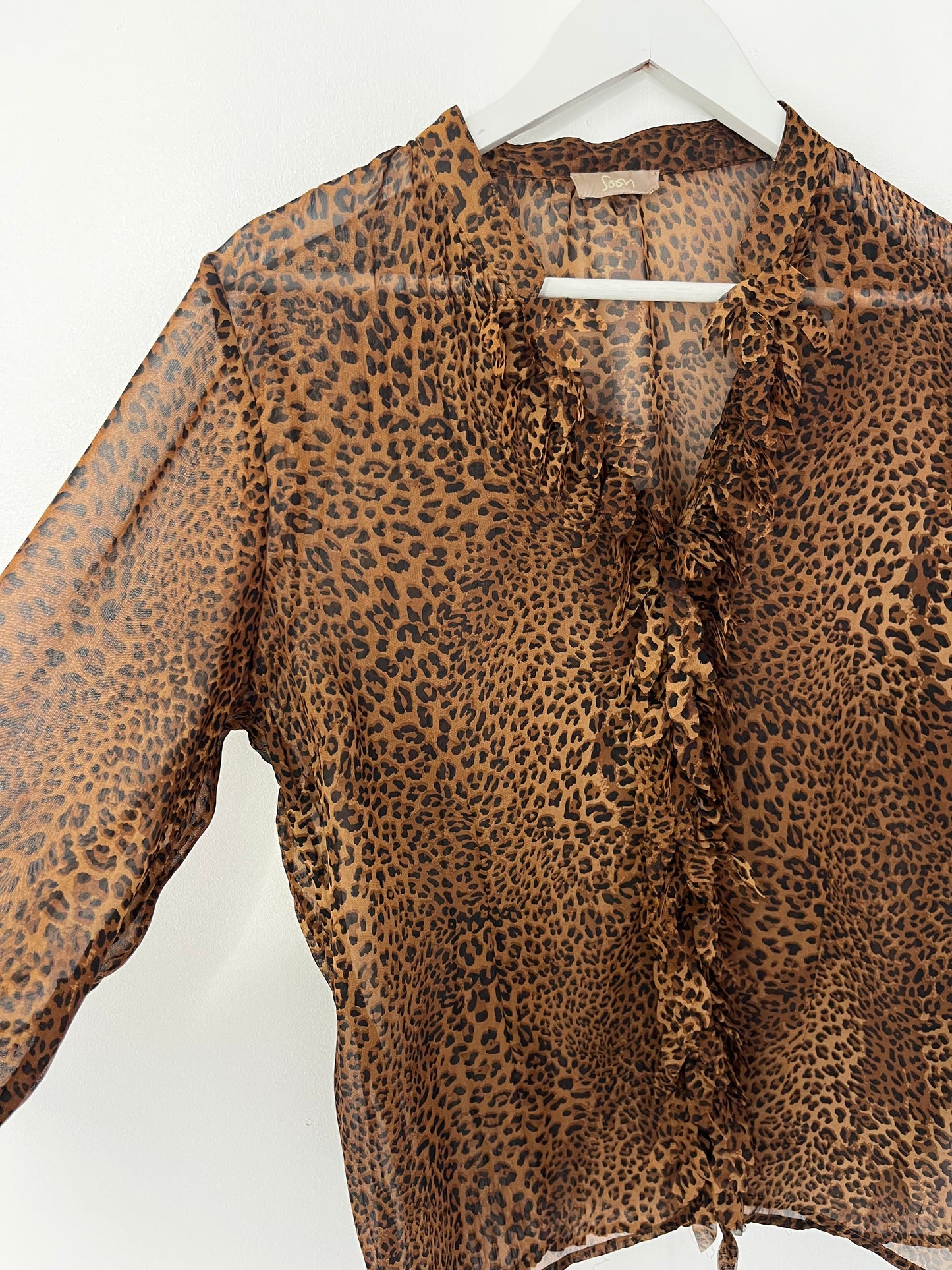 Semi Sheer Animal Print Ruffle Blouse